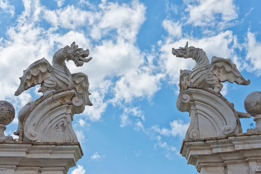 stone dragon statue on the blue sky background