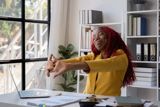 African American businesswoman is tired from working in the office..