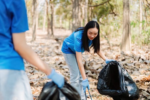 Group of volunteers, community members cleaning the nature from garbage and plastic waste to send it for recycling.