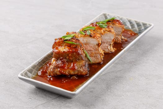 roasted appetizing pork on a stone background studio food photo 2