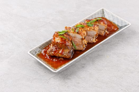 roasted appetizing pork on a stone background studio food photo 1