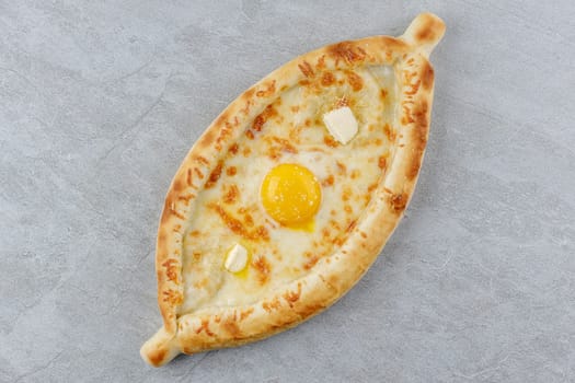 khachapuri in Adjarian style on a stone background studio food photo 4
