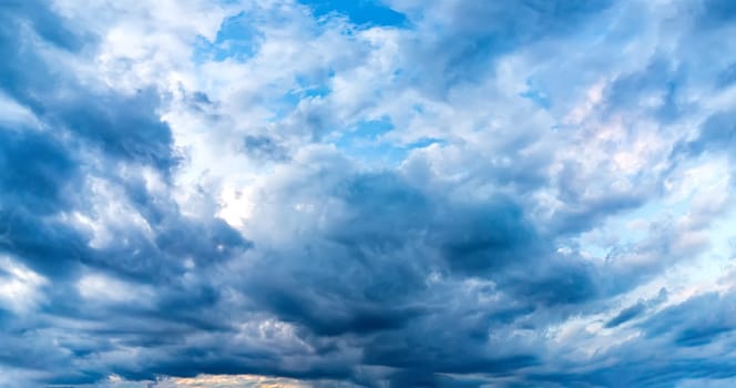 colorful clouds in the sky. Amazing view on the dramatic sunset sky