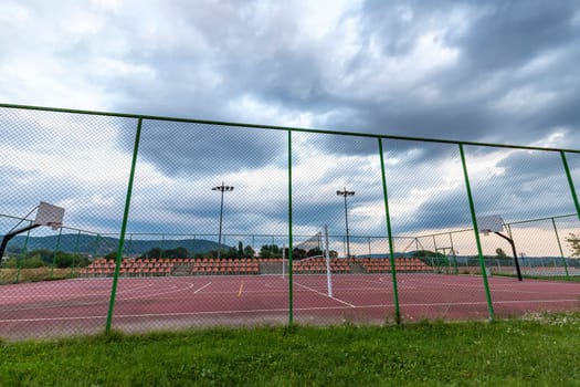 Sports ground in the city, public basketball and football court