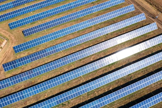 Aerial top view from drone of a field of solar panels