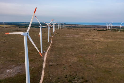 Aerial view of a row of wind turbines. Horizontal view