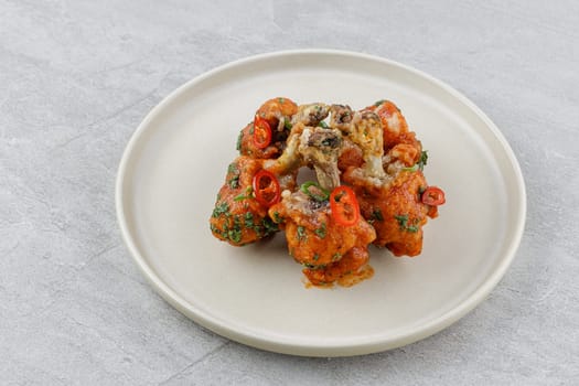 chicken wings baked on a stone background studio food photo 3