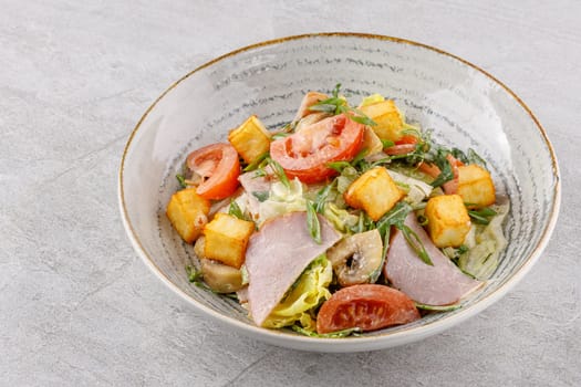 salad with ham and halloumi cheese on a stone background studio food photo 8