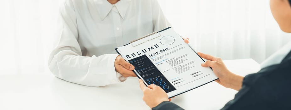 Corporate recruiter interview job applicant to discuss career goal and assess resume and experience. Job interview appointment for career opportunity and HR manager concept. Panorama Shrewd