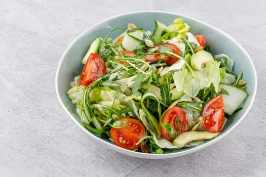 fitness salad with cherry tomatoes on a stone background studio food photo 1