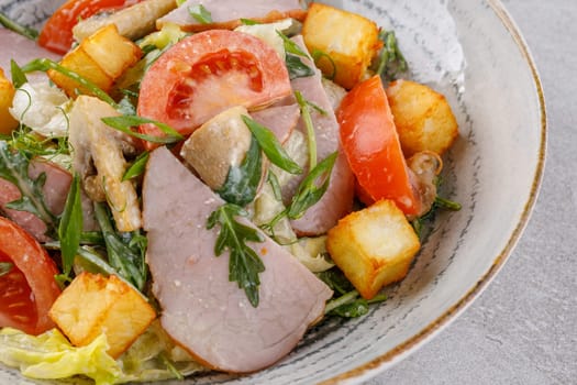 salad with ham and halloumi cheese on a stone background studio food photo 12