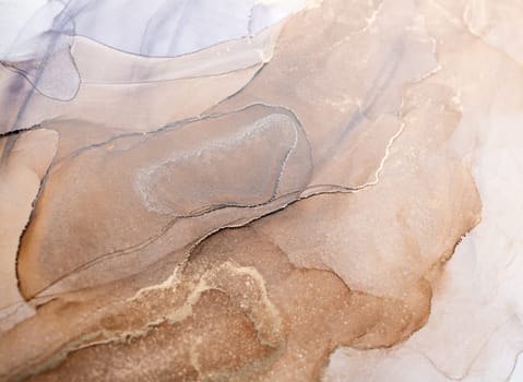 Tender and dreamy design. Luxury abstract fluid art painting in alcohol ink technique, mixture of bronze, silver, metallic and gold paints. Imitation of marble stone cut, glowing golden veins.