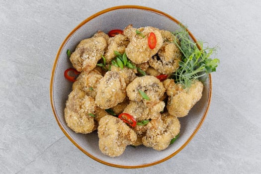 mushrooms in batter on a stone background studio food photo 6