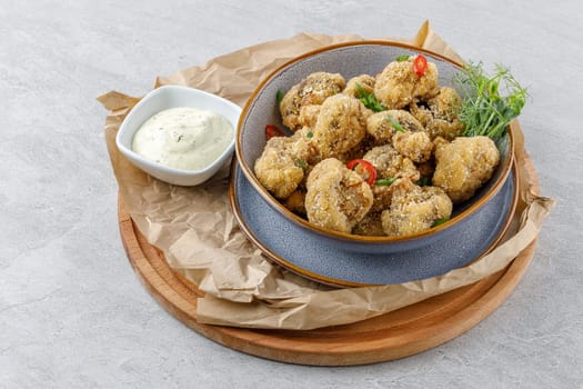 mushrooms in batter on a stone background studio food photo 4
