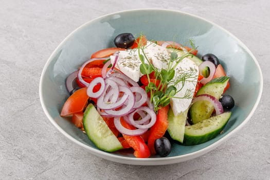 Greek salad on a stone background studio food photo 2