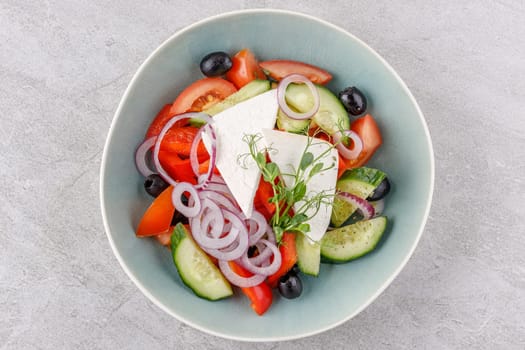 Greek salad on a stone background studio food photo 1