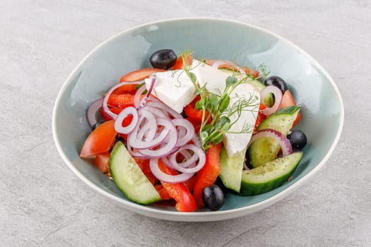 Greek salad on a stone background studio food photo