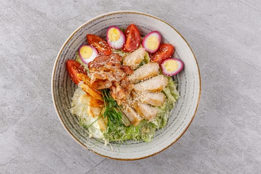 Caesar salad with chicken and bacon on a stone background studio food photo 6