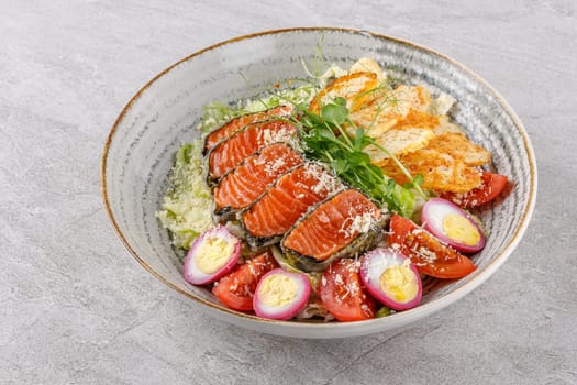 Caesar salad with baked salmon on a stone background studio food photo 5