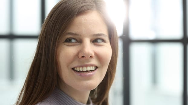 Close-up of a woman's face in the office.
