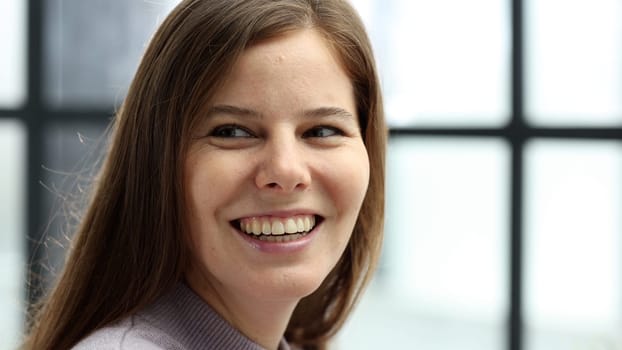 Close-up of a woman's face in the office.