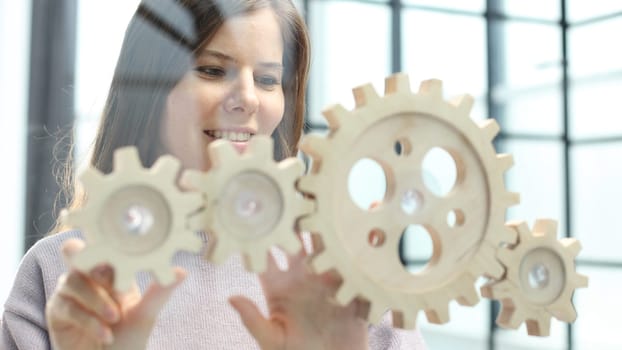 A woman in close-up in the office is thinking over a complex business plan.