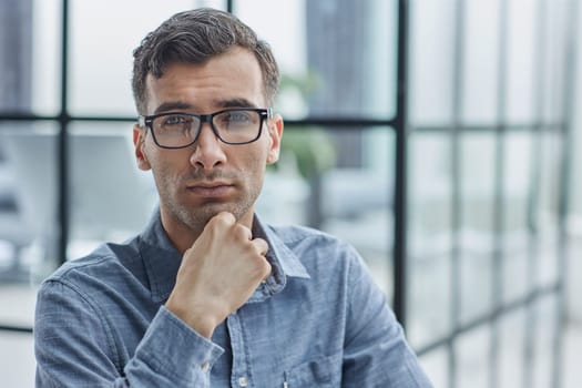 thoughtful male employee pondering considering idea