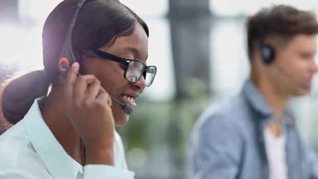 friendly operator woman agent with headsets working in a call center