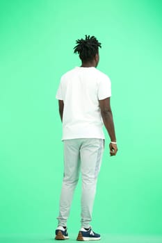 Man, full-length, on a green background.
