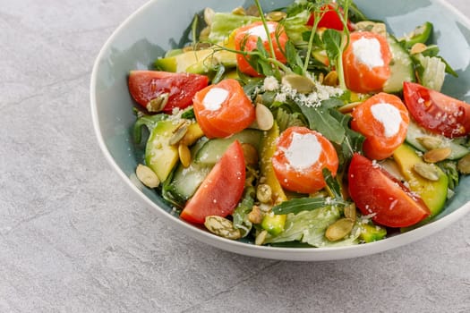 salad with salmon and cream cheese on a stone background studio food photo 3