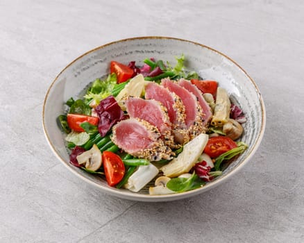 Tuna and artichoke salad on a stone background studio food photo 3