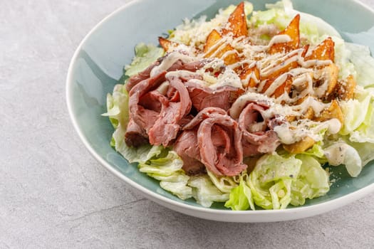 Salad with roast beef and potatoes on a stone background, studio food photo 6