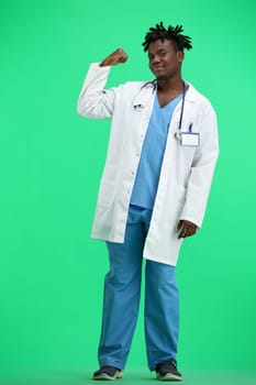 The doctor, in full height, on a green background, shows a call sign.