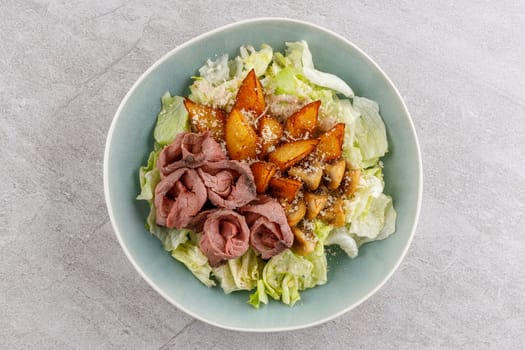 Salad with roast beef and potatoes on a stone background, studio food photo 3