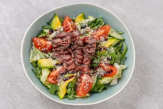 Salad with roast beef, avocado and tomatoes on a stone background studio food photo 4