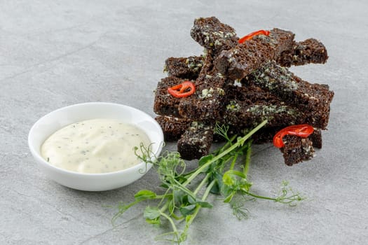 fried slices of black bread on a stone background studio food photo 1