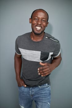 Portrait of an attractive cool guy on a gray background