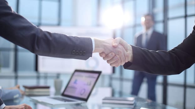 Businessmen at the conference signing a successful contract.