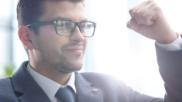 The male businessman is satisfied with the successful transaction.