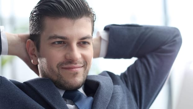 A male businessman takes a close-up rest after work.