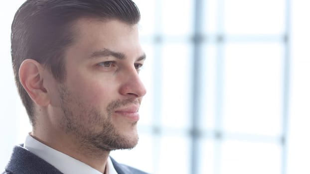 A businessman man working in the office in close-up.