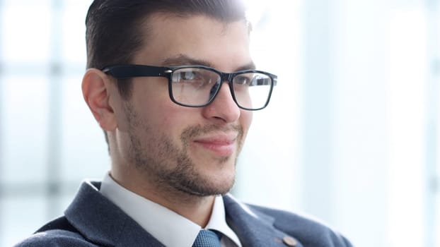 A businessman man working in the office in close-up.