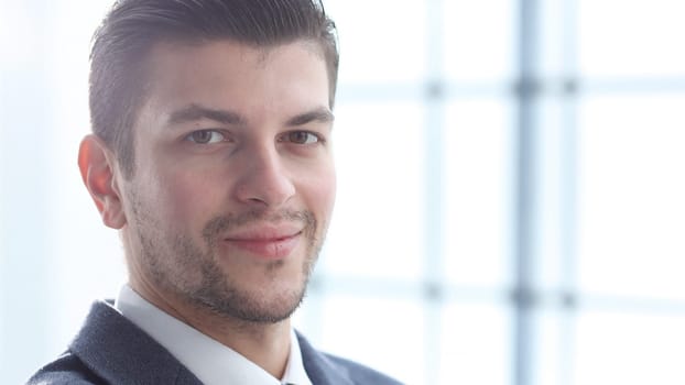 A businessman man working in the office in close-up.