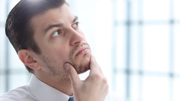 A businessman man working in the office in close-up.