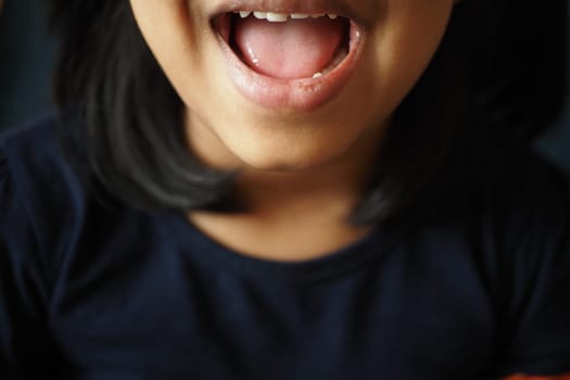 close up of child screaming at home , slow motion