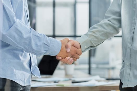 Close up of handshake in the office