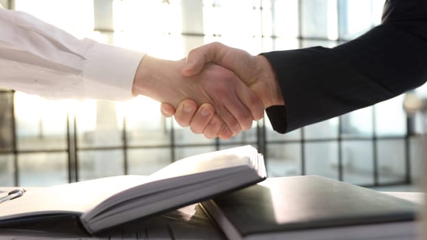 A handshake after a successful business transaction.