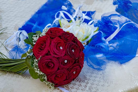 red roses bride bouquet close up detail