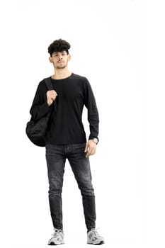 A man, on a white background, full-length, with a backpack.