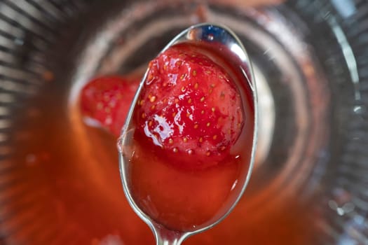 fresh strawberry on spoon macro detail